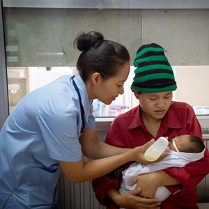 Cambodian Nurse Baby Milk Feeding